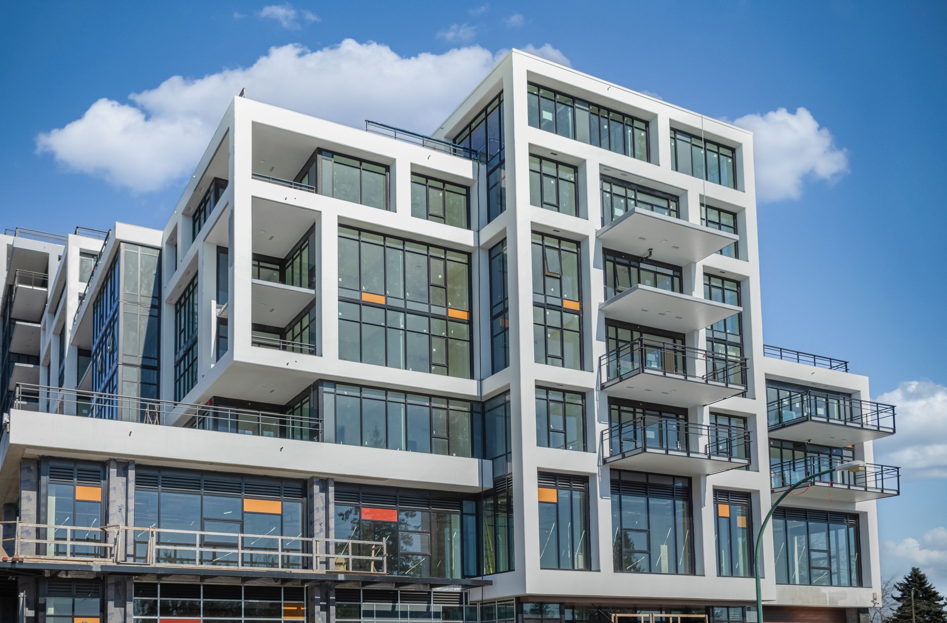 New Modern House Apartment Buildings in Vancouver BC. Canadian modern residential architecture on sunny summer day